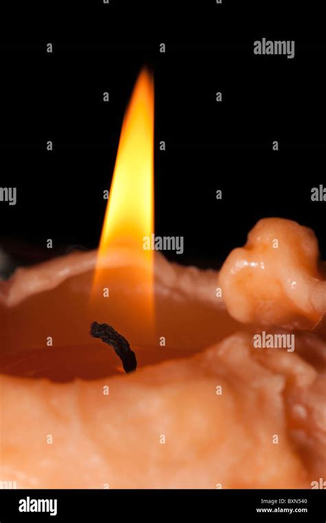 Closeup of candle wick burning with flame Stock Photo - Alamy
