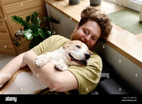 Man sleeping in dog bed hi-res stock photography and images - Alamy