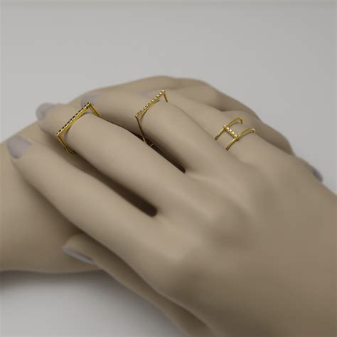 Ring in lustrous gold and dark blue sapphires | KORI Shop