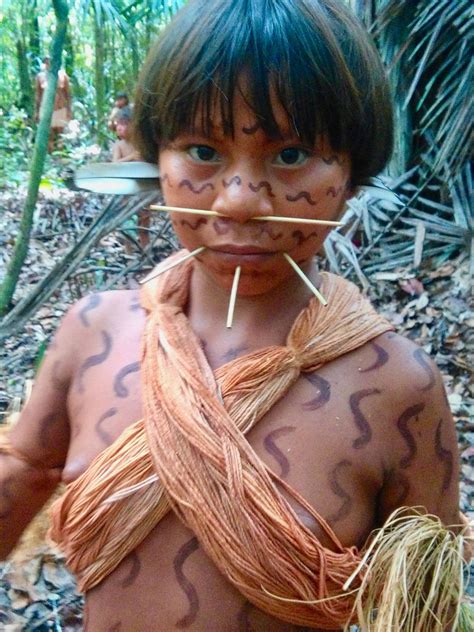 Yanomami girl and her family in the forest, Amazonas, Venezuela. NO to