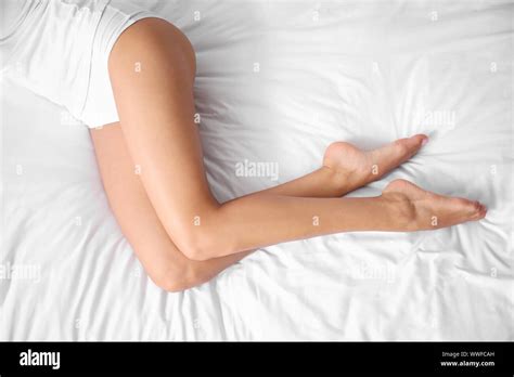 Morning of beautiful young woman on bed, top view Stock Photo - Alamy