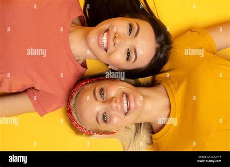 friends smile  yellow background friendship concept stock