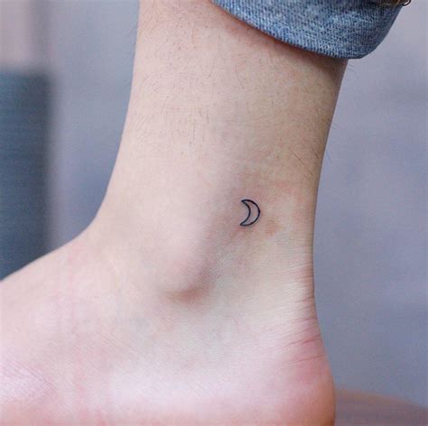 Tiny crescent moon by @wittybutton_tattoo - Tattoogrid.net