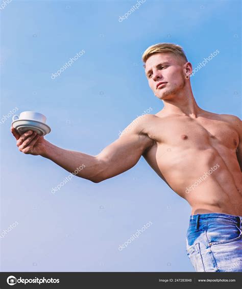 Sexy torso attractive waiter. Man muscular athlete bodybuilder offers