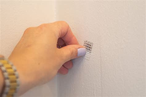 how to fix nail holes on wall
