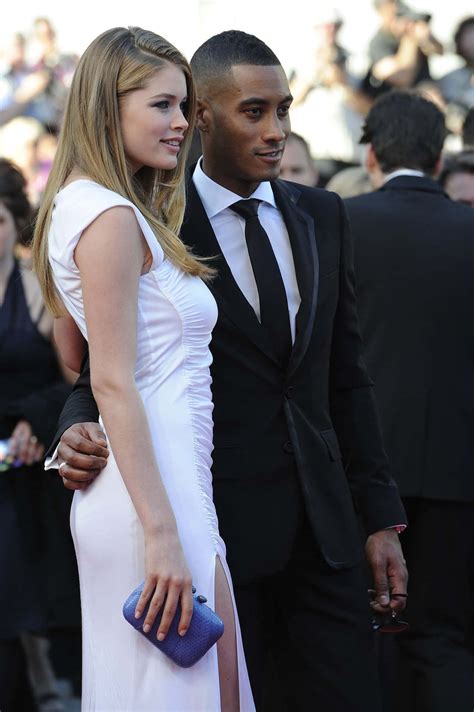 Download Interracial Couple In Red Carpet Wallpaper | Wallpapers.com