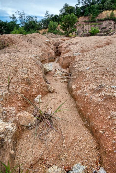 Premium Photo | Soil mining the causes of soil erosion on the land