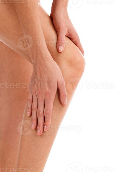 Closeup shot of woman holding sore knee, isolated 35270642 PNG