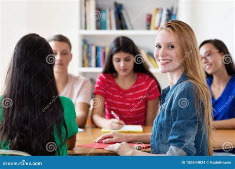 Russian Female Student Learning with Group of Students Stock Photo ...