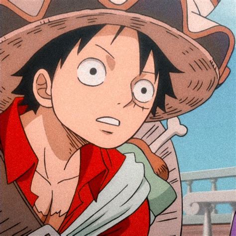 an anime character wearing a large hat and red shirt