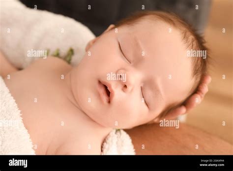 Parent with cute sleeping baby at home, closeup Stock Photo - Alamy