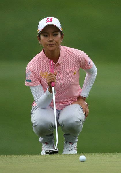 Ai Miyazato Photos - Ai Miyazato of Japan lines up her putt on the 18th hole during the third ...