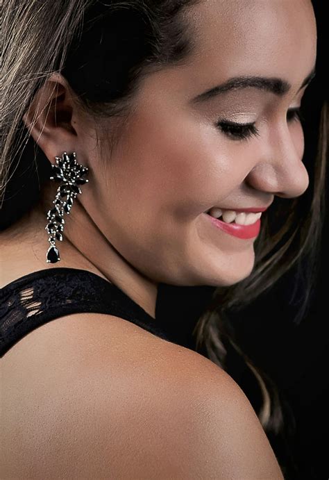 Woman Wearing Silver-colored Earring · Free Stock Photo