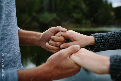 Black and white couple holding hands Stock Photo | Adobe Stock