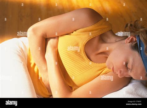 ABDOMINAL PAIN IN A WOMAN Stock Photo - Alamy