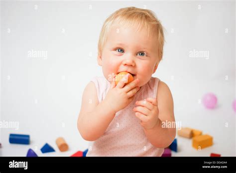 Smiling baby with toys Stock Photo - Alamy