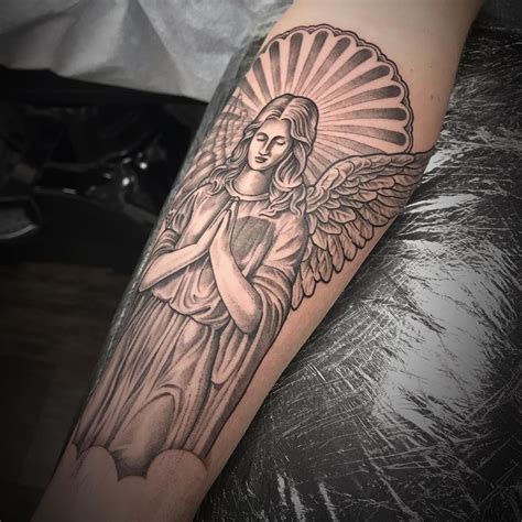 guardian angel face tattoo