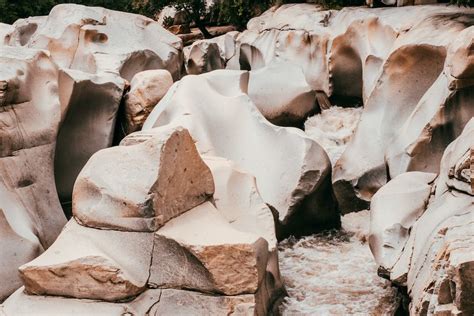 White Rock Formation on Brown Sand · Free Stock Photo