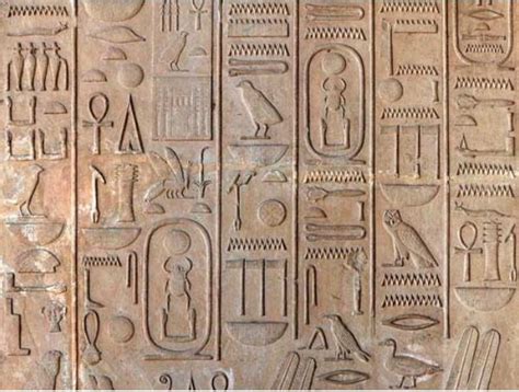 an egyptian hieroglyphic with symbols and other things on it's side