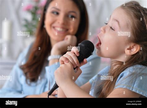 mom  daughter sing stock photo alamy