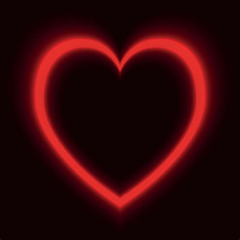 Red neon heart on black background 17638113 Vector Art at Vecteezy