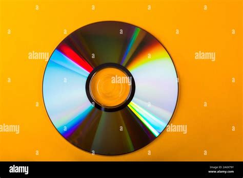 cd isolated  yellow background stock photo alamy