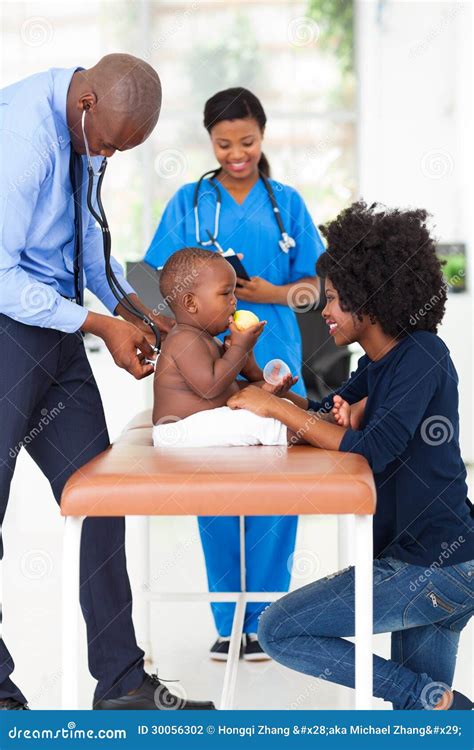 pediatrician examining baby stock photo image  healthcare care