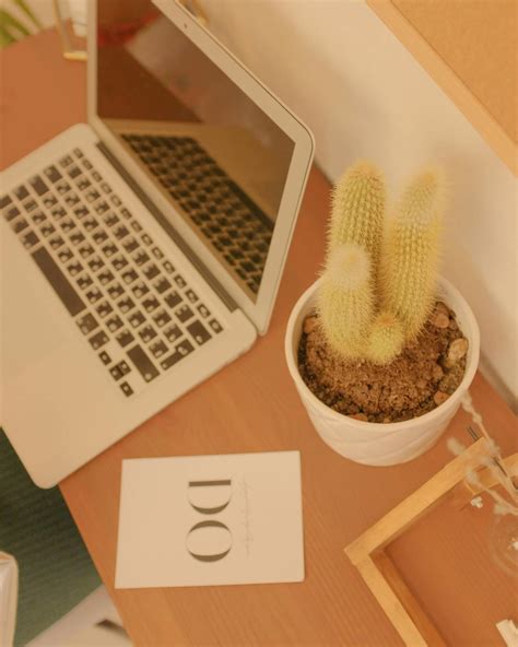 White Laptop on Brown Wooden Table · Free Stock Photo