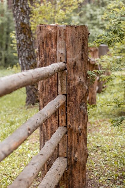 premium photo large wooden fence posts  enclose   wooden