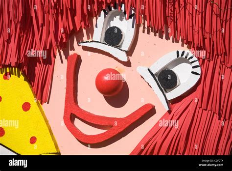 Smiling clown face made of painted polystyrene, foam rubber and wooden ...