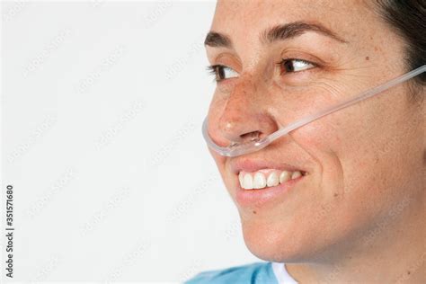 Sick female patient with a nasal cannula Stock Photo | Adobe Stock