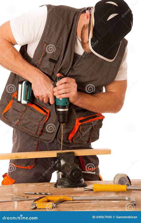 young carpenter drilling  hole   wooden slat isolated   stock