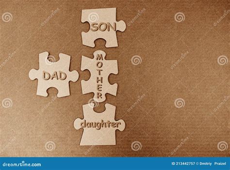 Dad, Mom, Son and Daughter Lettering on the Puzzle Pieces.the Concept of a Full Fledged Family ...