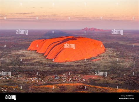 Uluru and Kata Tjuta at sunrise, Aerial view. Northern Territory ...
