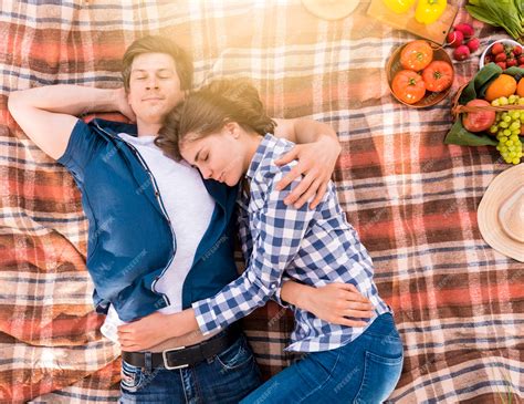 Free Photo | Young couple hugging and sleeping on plaid